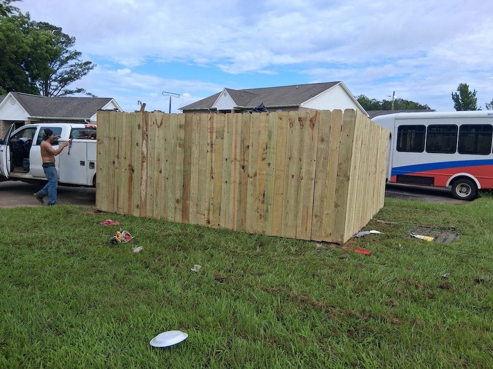 Fence installation along a property boundary in Birmingham, AL